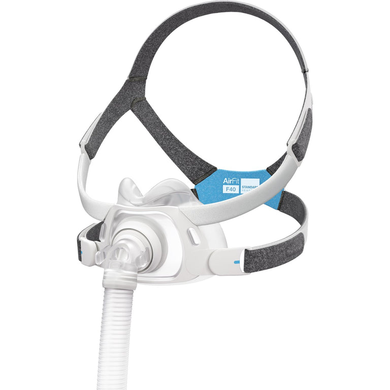 A full face CPAP mask with headgear and a central cushion, connected to a tube, against a white background.