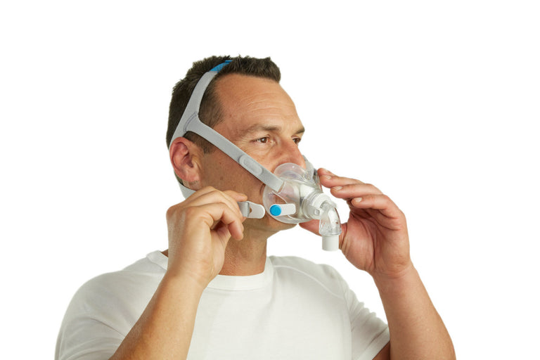 Man adjusting ResMed AirFit F30 Full Face Mask