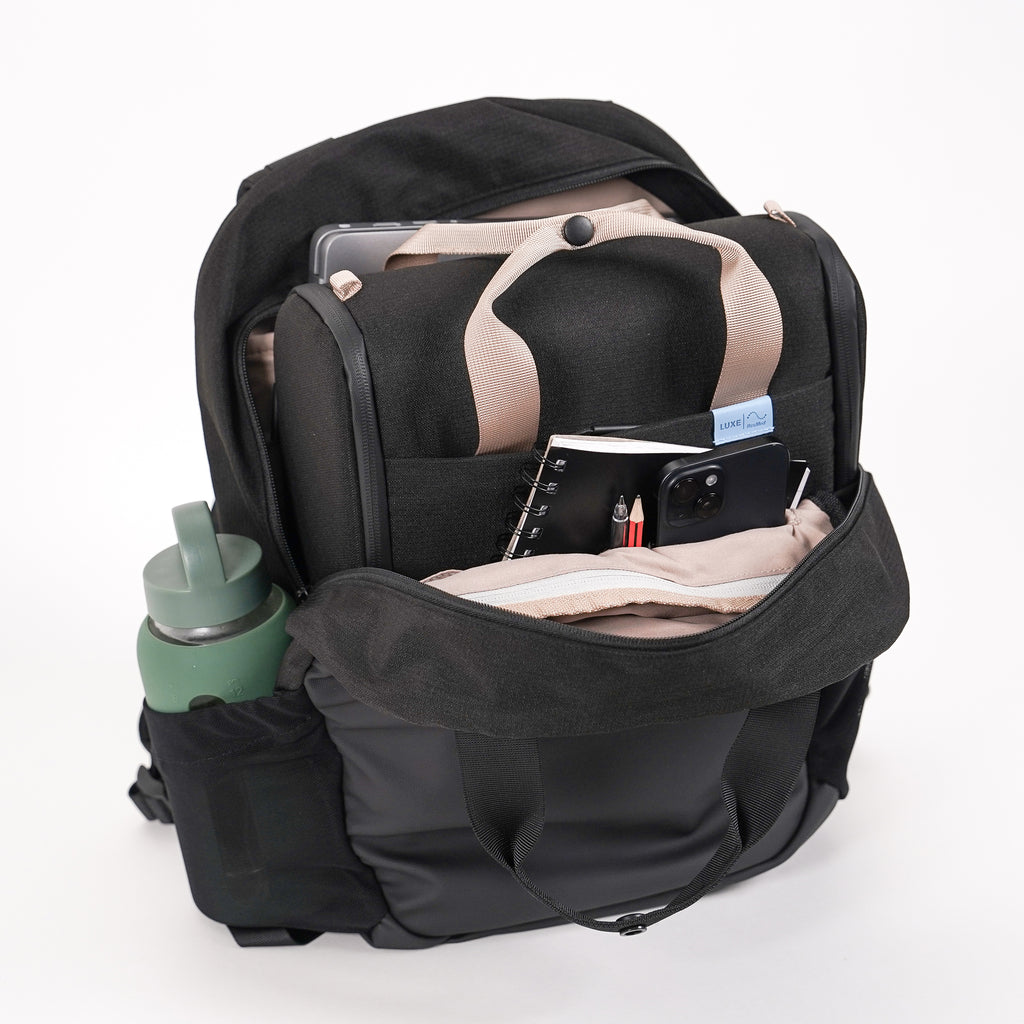an open backpack in black, inside there is a CPAP insert in black 