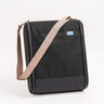 CPAP insert in black with beige straps draped ontop