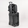 Luxe bag straps attached to the extended handle of the lugage