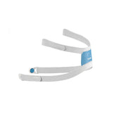 A grey CPAP mask headgear with blue accents 