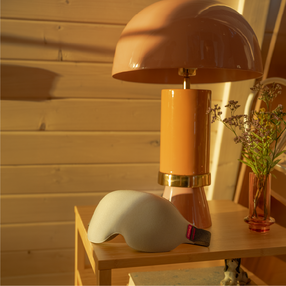 Nyx mask on the bedstand next to a lamp