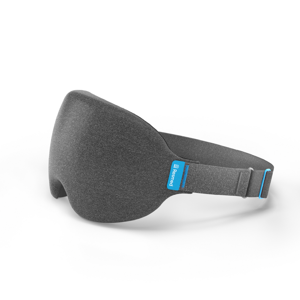 White background with Nyx mask, the mask is charcoal grey and facing the left