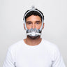 Man wearing F30i Mask, he is wearing a white t shirt and is standing infront of a white background