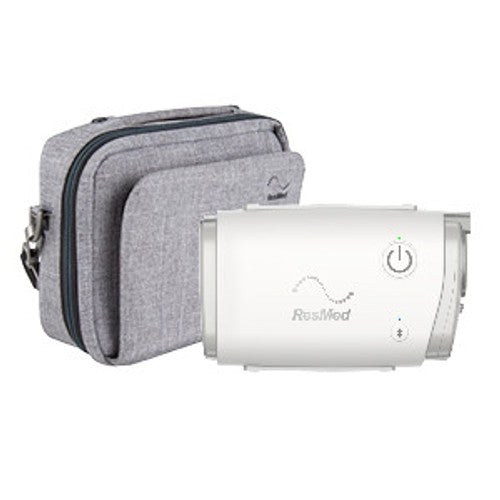 An AirMini Automatic CPAP device next to a grey carry case.