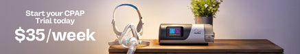 CPAP machine with mask on a wooden table with promotional text.