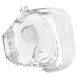 A transparent, silicone cushion part of a CPAP mask designed to fit over the nose and mouth, with a visible soft padding area.