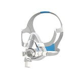 A full face CPAP mask with headgear and a transparent cushion